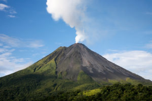 Arenal volcano in costa rica with a plume of smoke